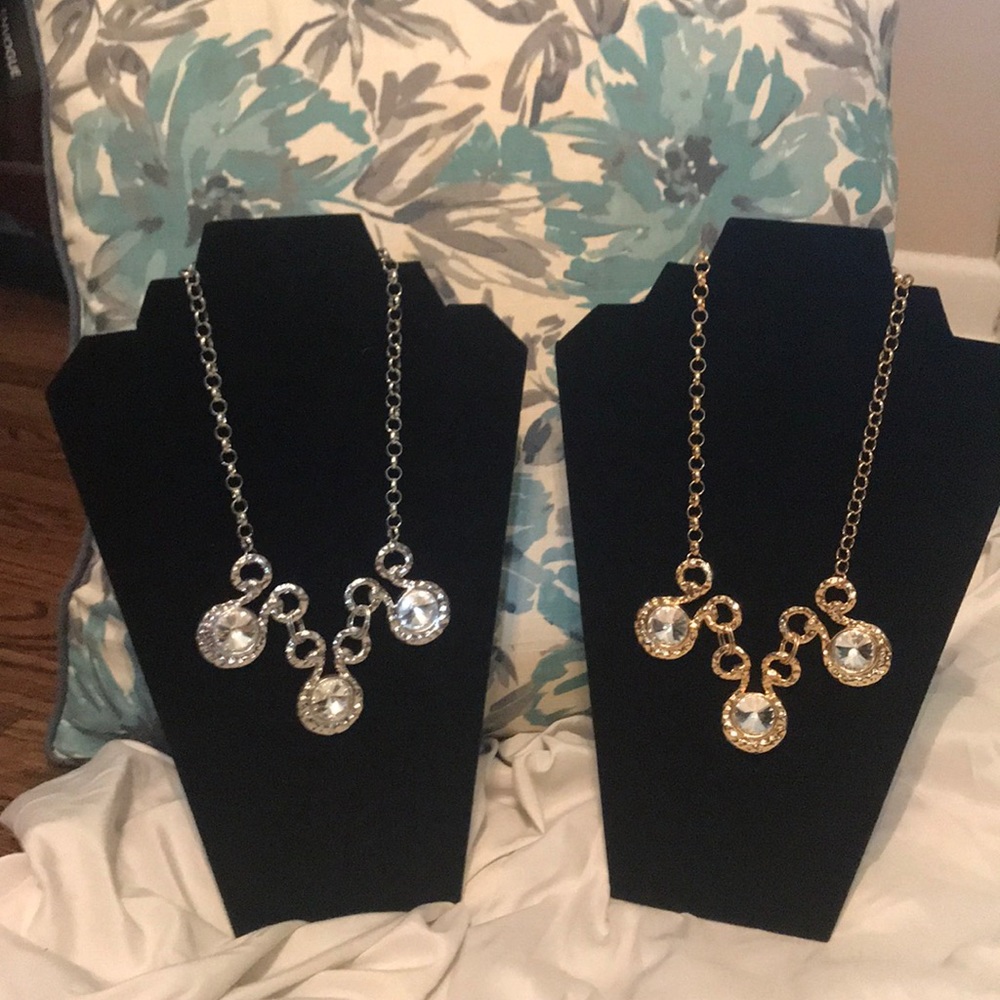 A gold and a silver necklace that is all sparkles